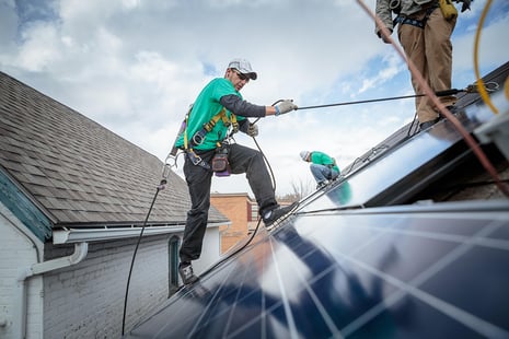 construction-crew-installing-solar-panels-on-a-hou-2022-03-07-23-56-47-utc