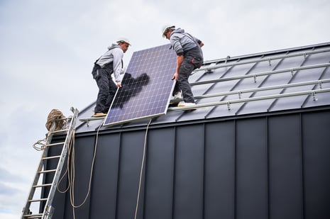 technicians-carrying-photovoltaic-solar-module-whi-2023-11-27-05-10-11-utc